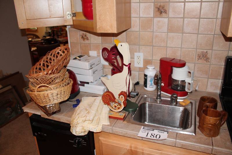 lot 180 image: Shelf Lot Including Wicker Baskets Coffee Maker Framed Picture And More.