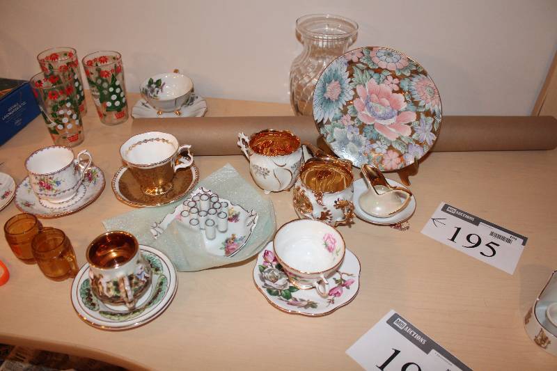 lot 195 image: Shelf Lot Including Collectible Tea Cups & Saucers Glass Ware Vase Dish Ware And More.