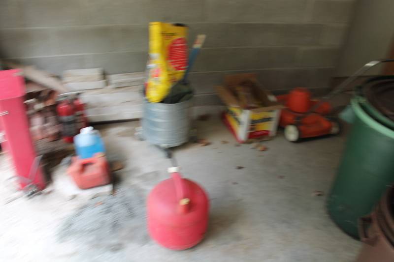 lot 197 image: Garage Floor Lot Including Gas Can Push Lawn Mower Cat Litter Mop Bucket wWheels And More.