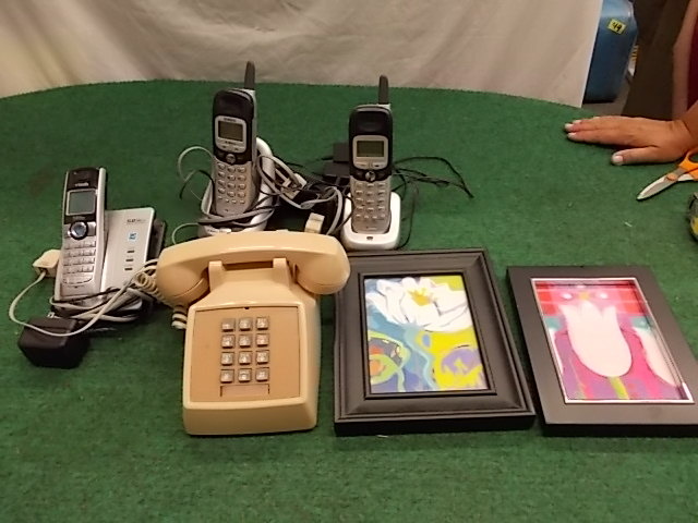 Telephones and Framed Pictures