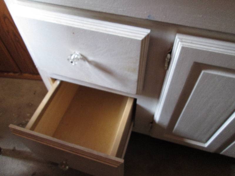 White cabinet with drawers and cupb...