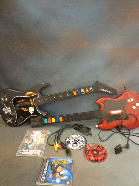 lot 16 image: Guitar Hero Guitars and PS Games