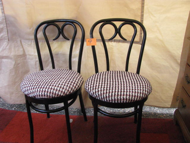 pair of black parlor chairs with black and white covering