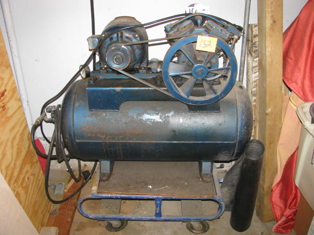 large air compressor with hose and reel