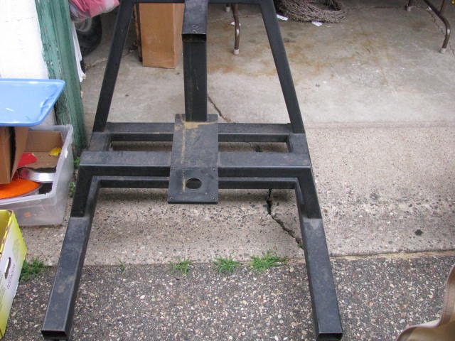 large metal garage or shop stand on wheels