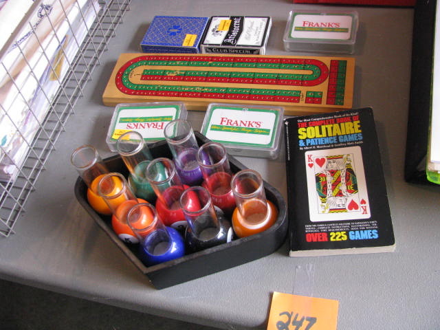 pool table shot glasses cribbage board and decks of cards