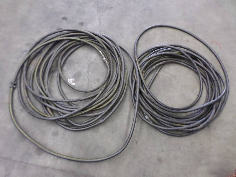 lot 56 image: (2) 100ft Garden Hoses ...