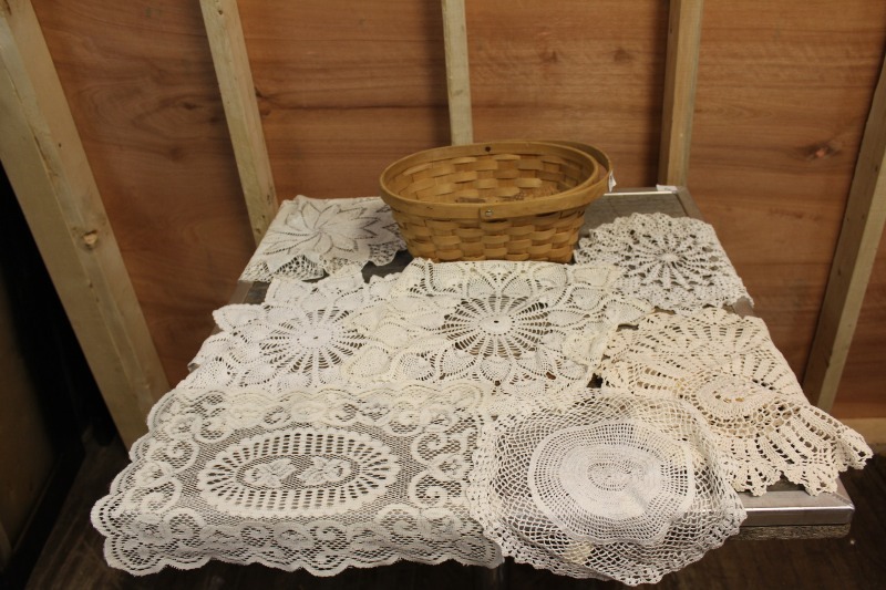 lot 96 image: Doilies and Basket of Corks