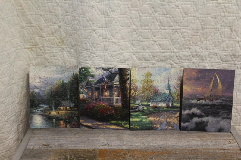 lot 246 image: Set of 4 Small Thomas Kincaid Glued Puzzles