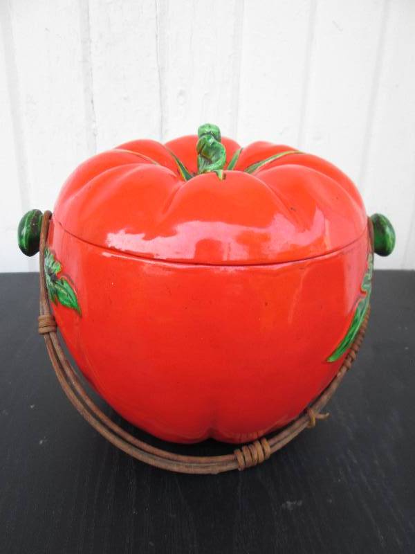 Very old pot, looks like a tomato. ...
