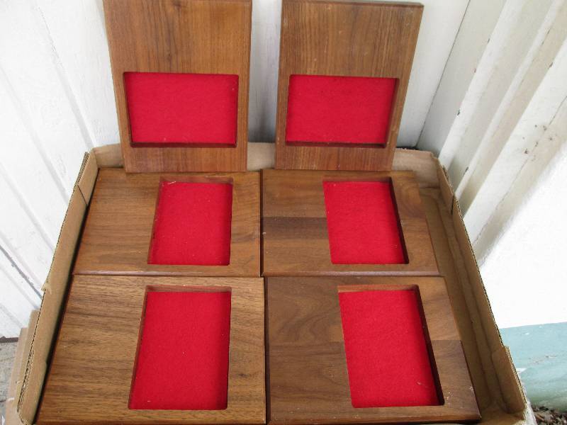 6 walnut frames with red felt backs...