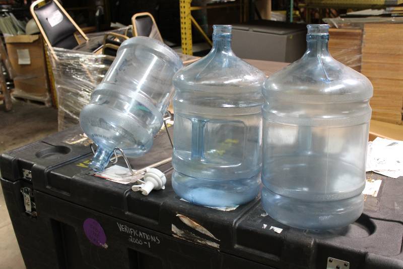 Lot of (5) Including 5 Gallon Poly Carbonate Bottles (3) Metal Stand (1) Plastic Nozzle Spout (1).