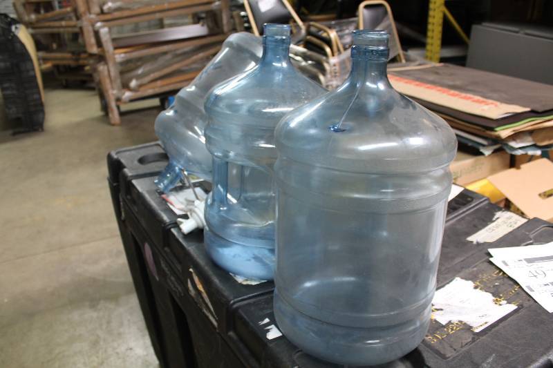 Lot of (5) Including 5 Gallon Poly Carbonate Bottles (3) Metal Stand (1) Plastic Nozzle Spout (1).