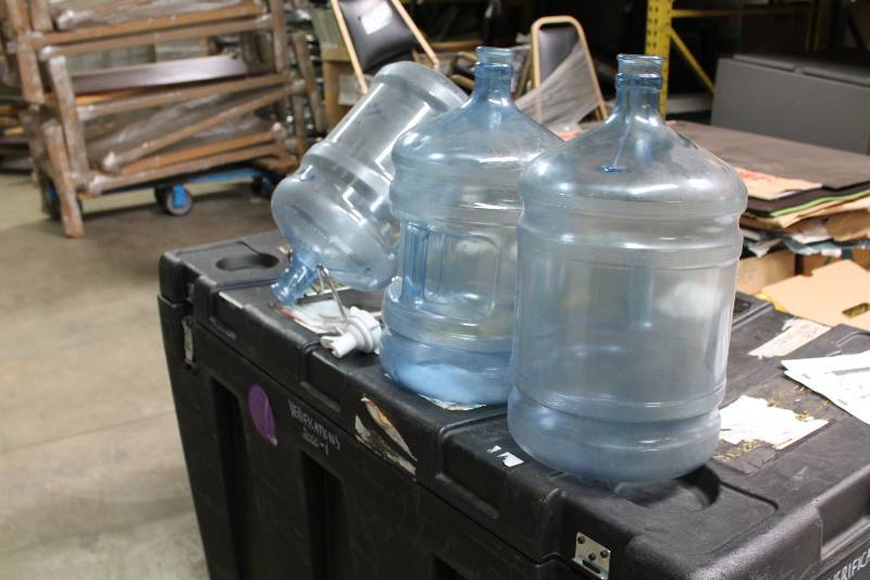 Lot of (5) Including 5 Gallon Poly Carbonate Bottles (3) Metal Stand (1) Plastic Nozzle Spout (1).