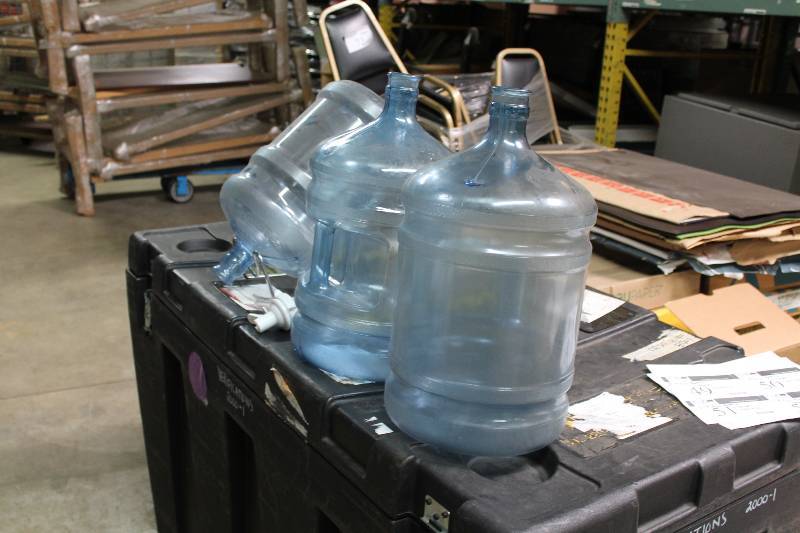 Lot of (5) Including 5 Gallon Poly Carbonate Bottles (3) Metal Stand (1) Plastic Nozzle Spout (1).