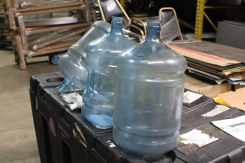 Lot of (5) Including 5 Gallon Poly Carbonate Bottles (3) Metal Stand (1) Plastic Nozzle Spout (1).