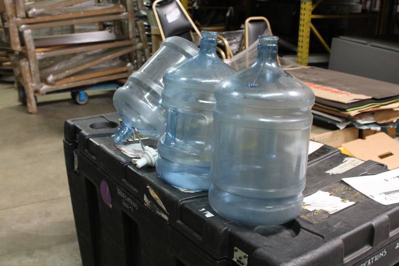 Lot of (5) Including 5 Gallon Poly Carbonate Bottles (3) Metal Stand (1) Plastic Nozzle Spout (1).
