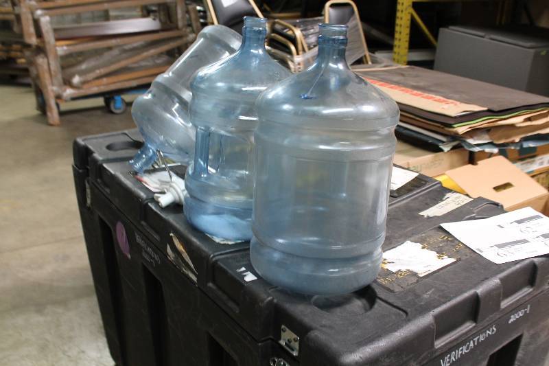 Lot of (5) Including 5 Gallon Poly Carbonate Bottles (3) Metal Stand (1) Plastic Nozzle Spout (1).