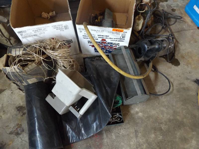 Assortment including boots and tools.