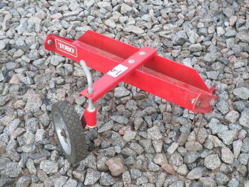 lot 9 image: Toro 21 Lawn Mower Thatcher Attach...