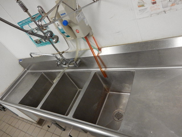 lot 5 image: Stainless Steel Sink. 3 Section and 2 Drainboards, Sprayer Attachment.