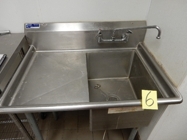 lot 6 image: Single Tub Sink.. Stainless Steel, NSF.  Drain Control in front.  You must unhook this yourself.. Bring your own tools and loading help.  Sink 16in x 20 in 12in D.