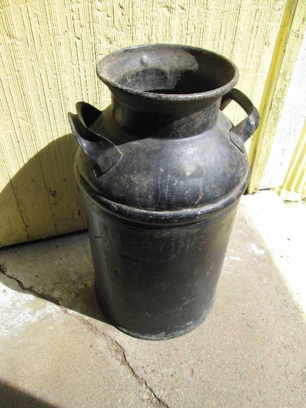 Metal milk pail, 2 feet tall...