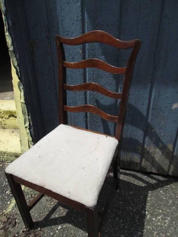 Vintage wood chair with plush white...