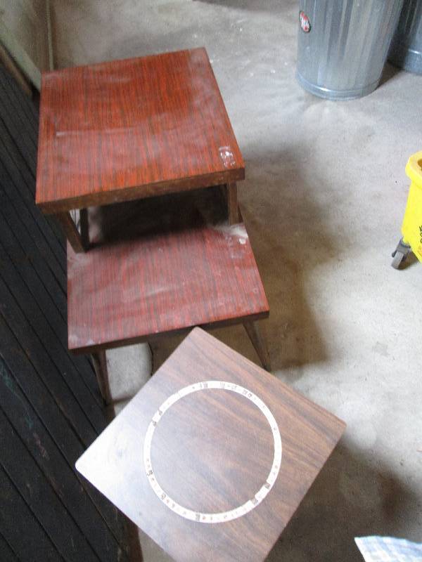 2 wood tables, mosaic circle on top...
