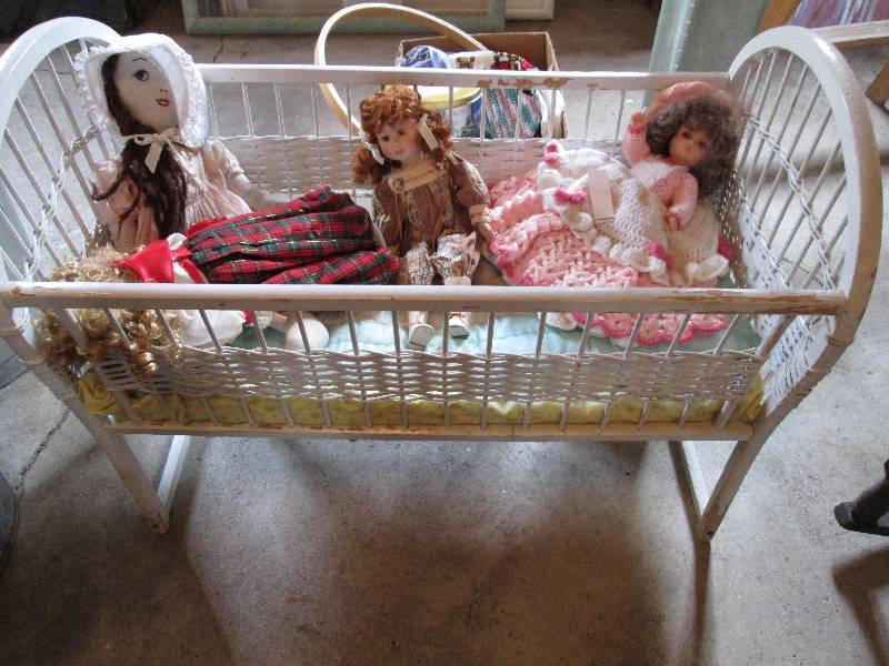 Vintage wicker doll bed with dolls,...