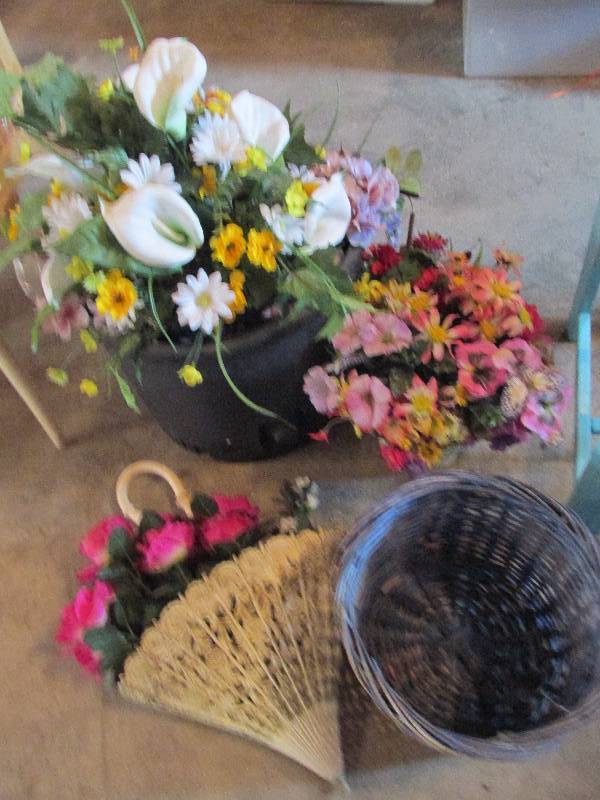 Planters filled with silk plants an...