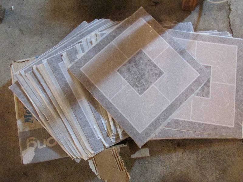 Approx. 30 laminate tiles, 1 foot s...