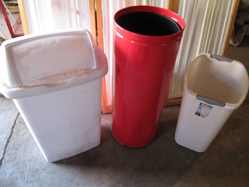 Red metal trash can with 2 plastic ...