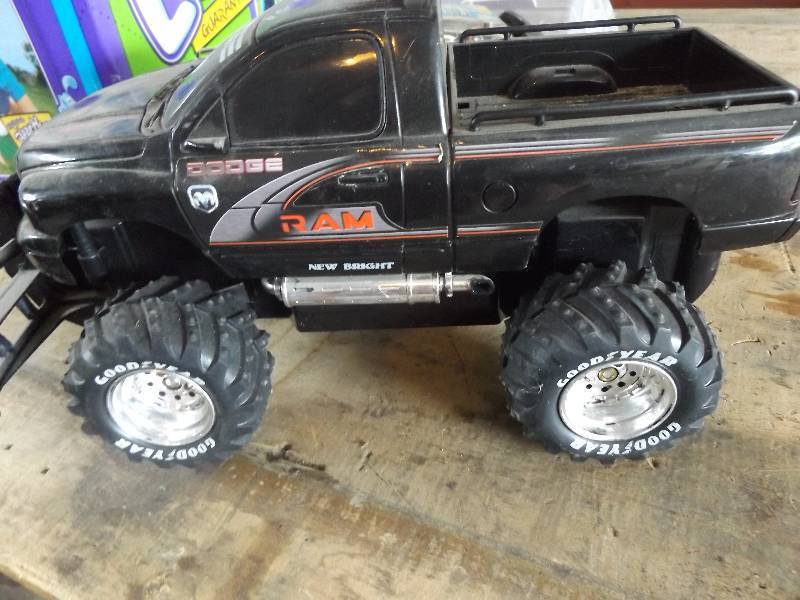 Assortment of books, remote control truck, misc,
