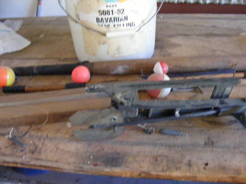 Fishing Poles and Louisville Slugger Bat