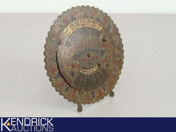 lot 18 image: Vintage Brass Calendar 1944-1998
