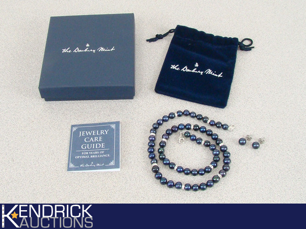lot 57 image: Mint in box Danbury Mint Blue Pearl Necklace, and Earring Set