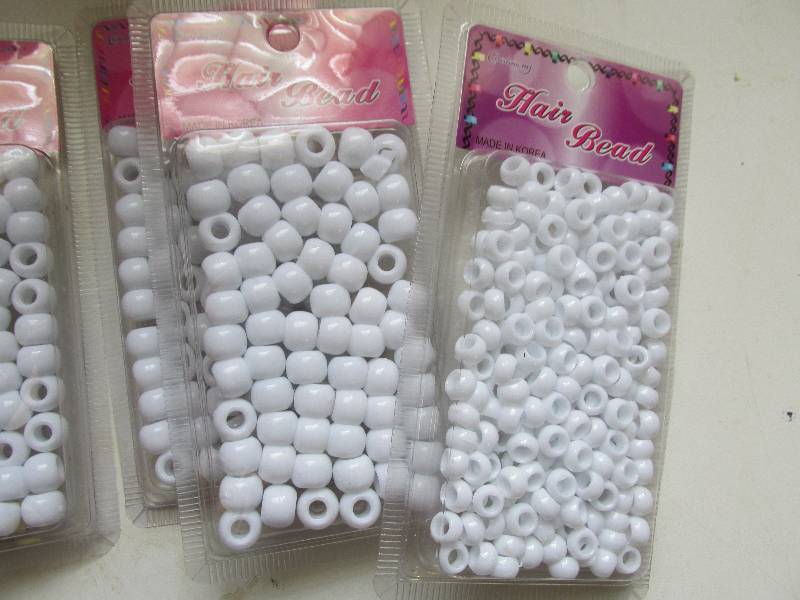 lot 146-COPY image: 7 packs hair beads small and medium...