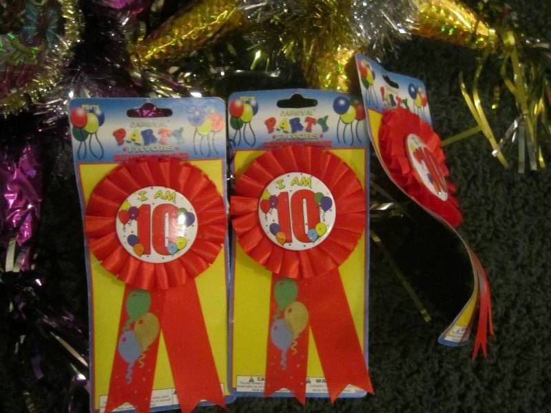 lot 262-COPY image: lot of 10 year old birthday pins an...