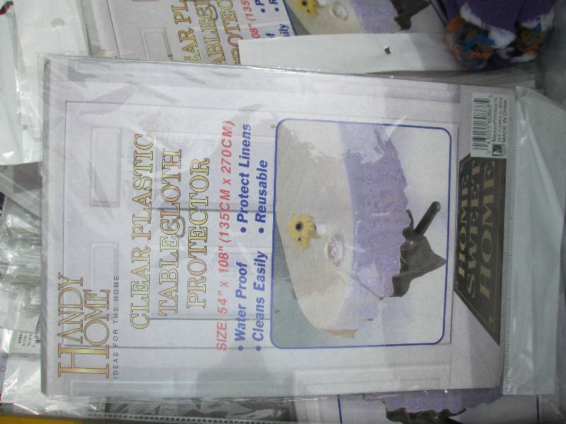 lot 36-COPY image: bananna box of plastic table covers...