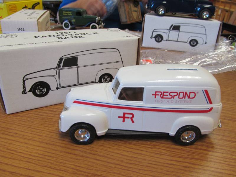 lot 10 image: 1950 Ford Respond First Aid Panel Delivery Van 124 Scale Diecast Bank