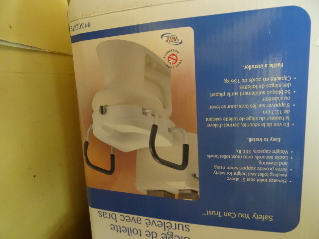 Raised toilet seat