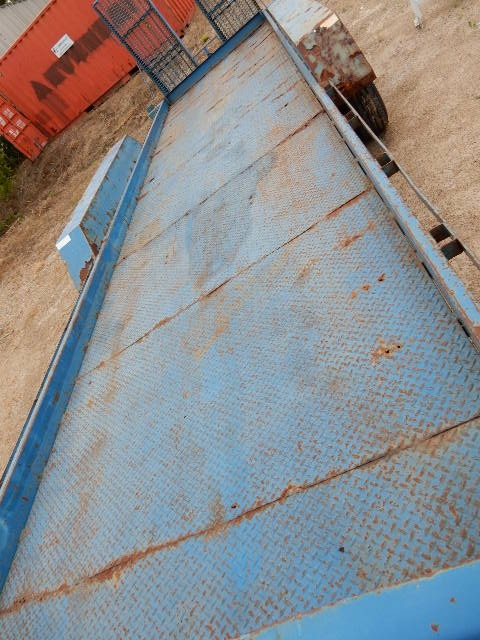 lot 9 image: 1991, Home Made Back Hoe Trailer.. Brakes and Lights work.  Bed is 25ftl x 75in wide.  Tongue, 6 ft.. Overall Length 31 ft.