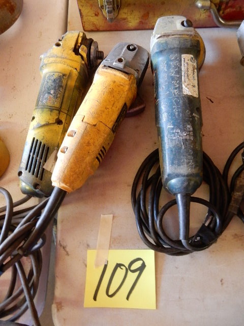 lot 109 image: Two DEWALT and one Bosch Four and One Half Inch Angle Grinders