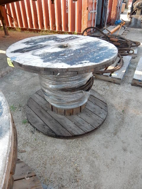 lot 55 image: Spool of 12 in Cable. See picture.. Not sure of amount