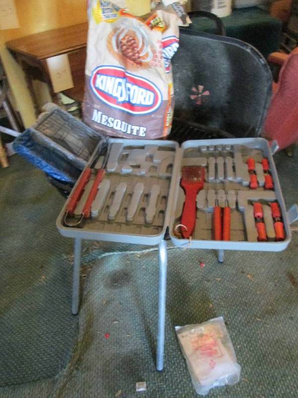 Charcoal grill with charcoal and ac...