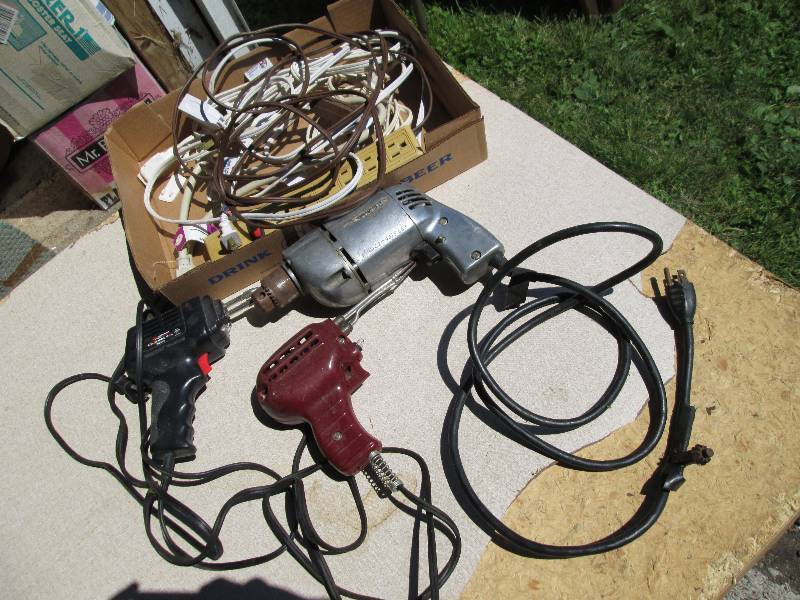Lot of solder guns, drill and cords...