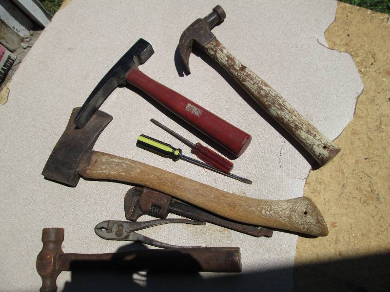 Lot of hatchets, hammers and tools...