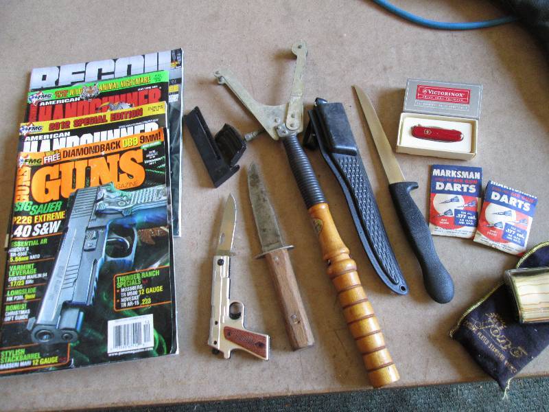 Lot of gun magazines, hunting knive...