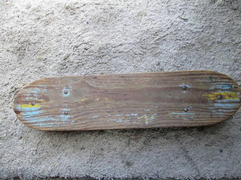 Vintage skateboard with wood deck...